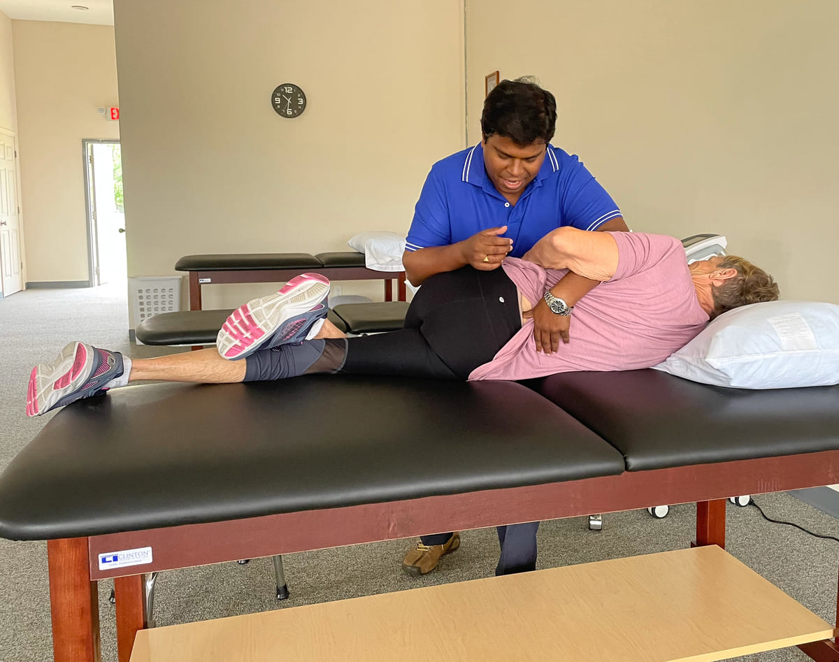Our PT in Indianapolis IN providing lower back therapy using manual manipulation